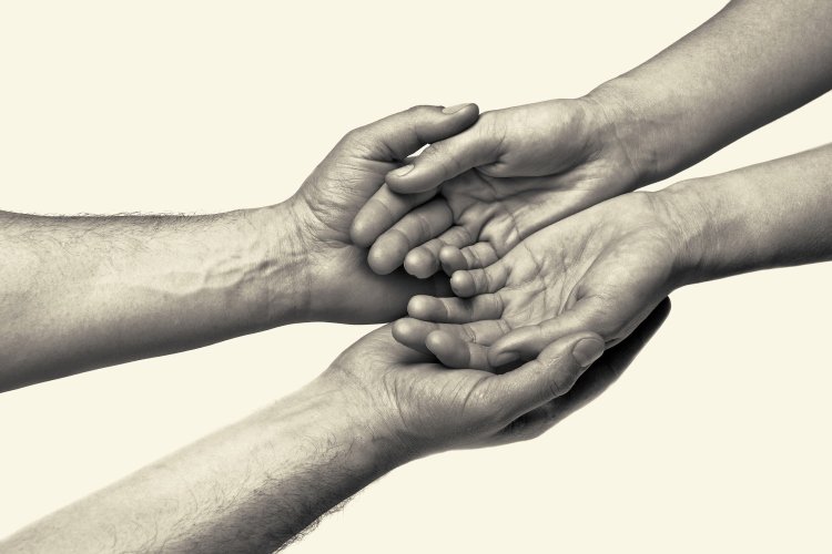 Touching Lives OMTimes Bigstock Hands Trust 101423411